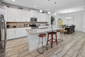 Fridge, microwave, oven, stovetop - 4715 SH - Storey Lake Hideaway 6BR Mansion Private Pool (Kissimmee)
