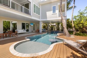 A heated pool - A Shore Thing: On Canal! Pool Spa!  Rooftop Deck by Anna Maria Life Vacation Rentals (Anna Maria)