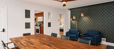 A modern kitchen with wooden cabinets, a microwave, and a stove.