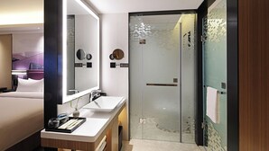 A modern hotel bathroom with a large mirror, two sinks, a shower, and a wooden vanity. - Hampton by Hilton Changsha South Station ICEC (Changsha)