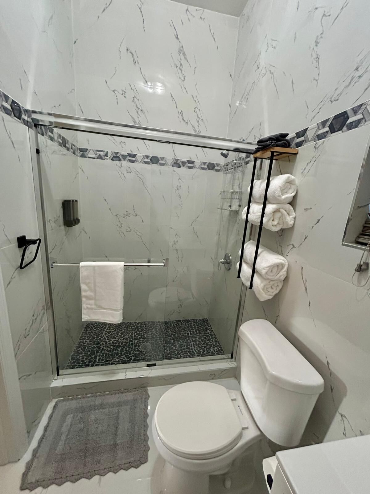 Shower, hair dryer, towels, soap