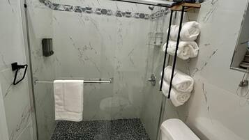 Shower, hair dryer, towels, soap