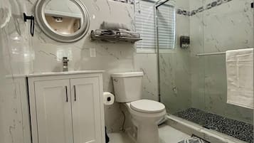 Shower, towels, soap, toilet paper