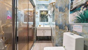 A bathroom with a marble wall, a sink, and a shower. - Townhouse District 10 Near Children Hospital 1 (Ho Chi Minh Municipality)