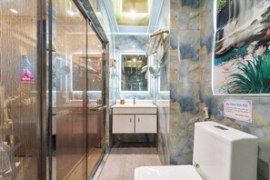 A bathroom with a marble wall, a sink, and a shower. - Townhouse District 10 Near Children Hospital 1 (Ho Chi Minh Municipality)