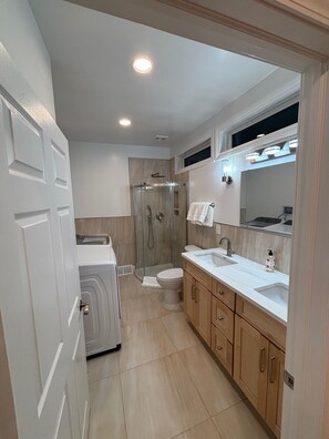 Shower, hair dryer, towels, toilet paper