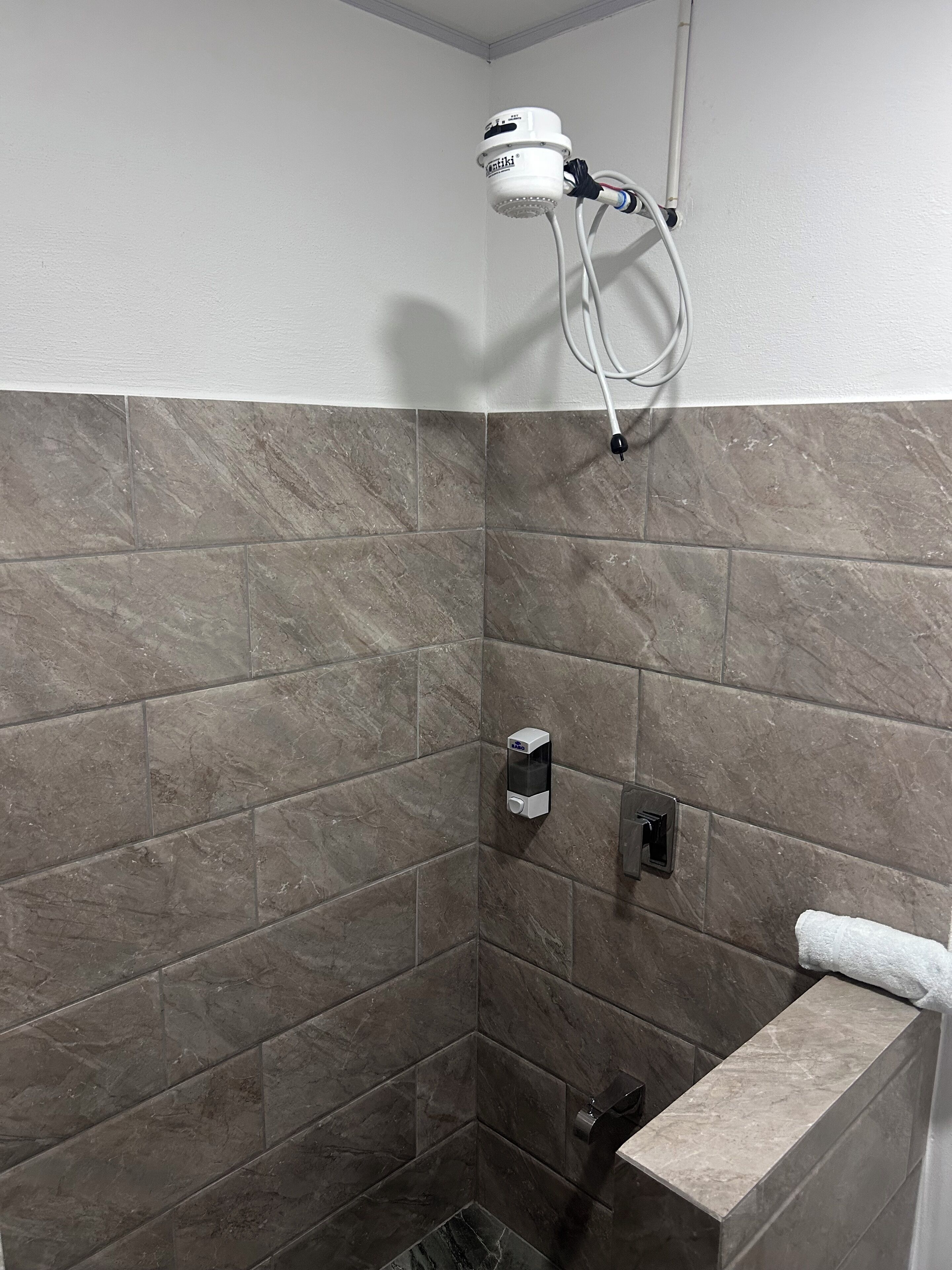 Shower, jetted bath, towels, soap