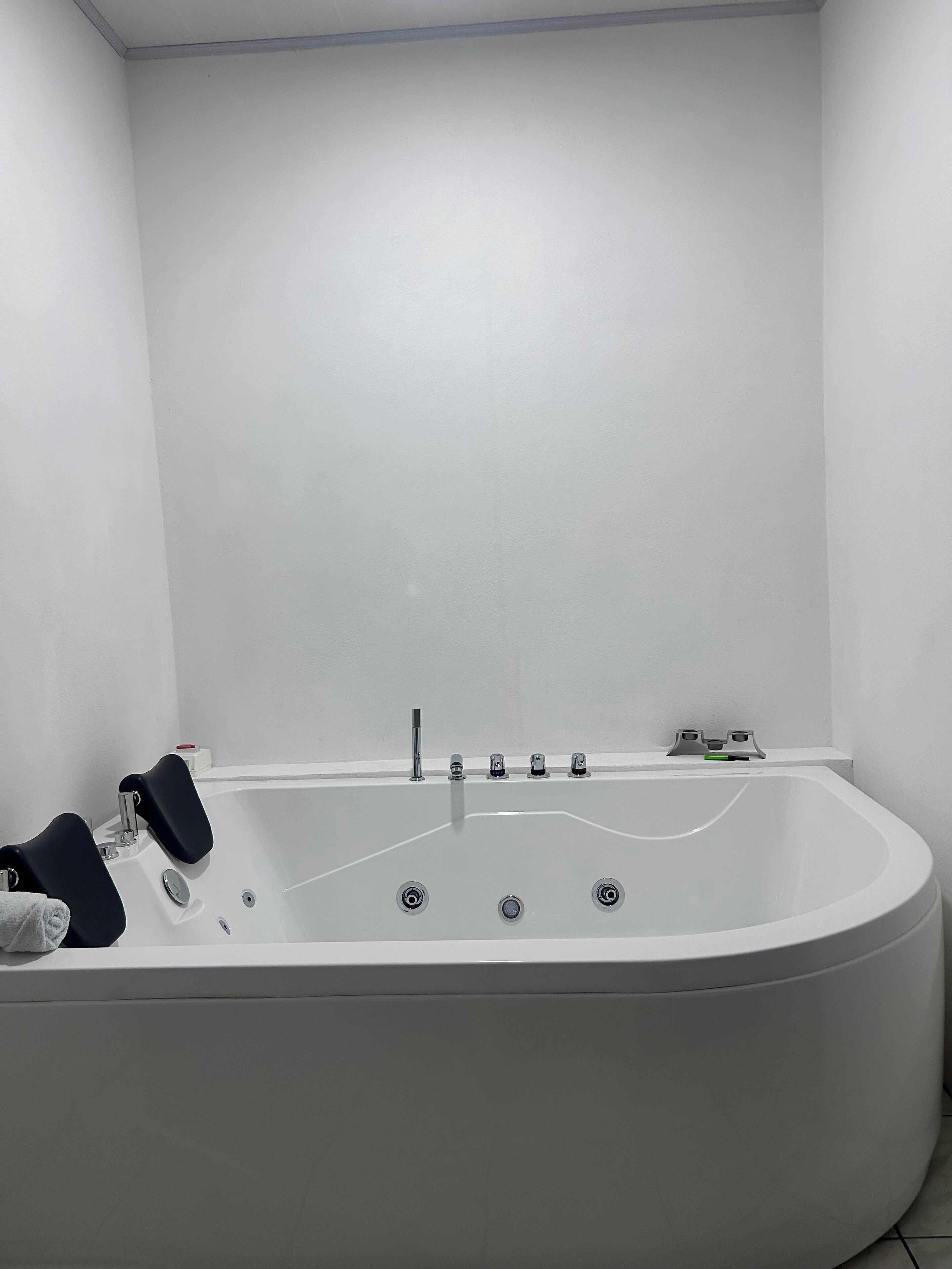 Shower, jetted tub, towels, soap