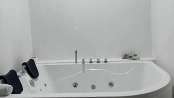 Shower, jetted tub, towels, soap