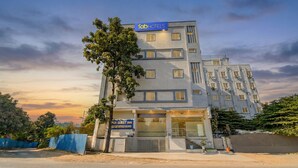 A multi-story hotel with a sign for 'fab hotels' and 'PGRESIDENCY'. - Fabhotel Pgr Guest Inn (Hyderabad)