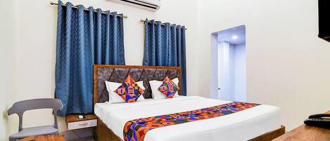 Chambre Deluxe | Draps en coton égyptien, literie de qualité, coffre-fort