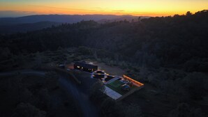 An aerial view of a secluded property with a main building, a swimming pool, and a tennis court. - The Hills Edge - Stunning Views, Hot Tub & Games (Mariposa)