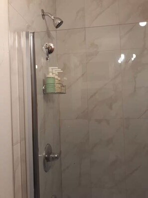 Shower, towels, soap, toilet paper