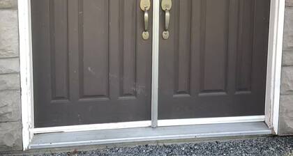 Small, renovated, private 1 bedroom bathroom in front of bus stop to downtown.