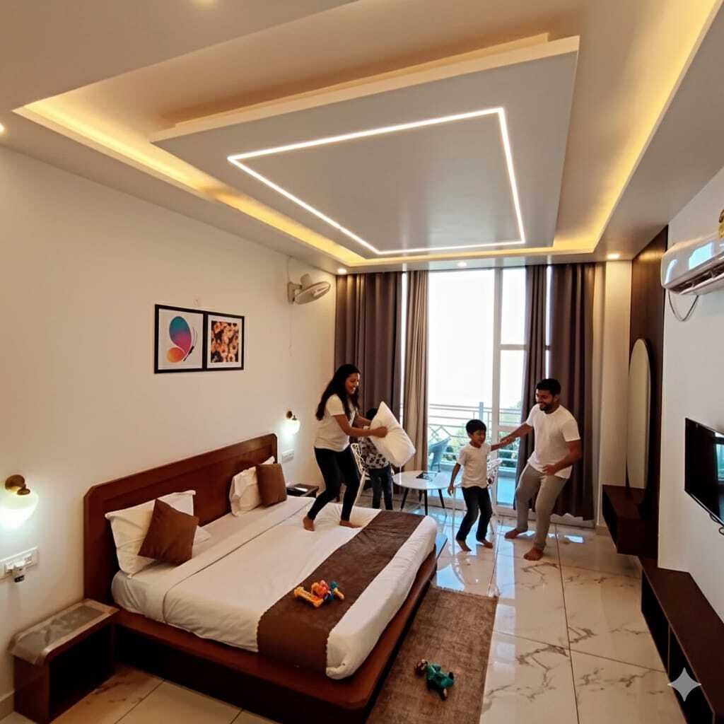 A modern hotel room with a large bed, a flat-screen TV, and a balcony with a view.
