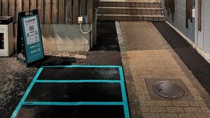 A hotel entrance with a wooden wall, a sign for the Luna Stella, and a LUUP sign. - HOTEL LUNA STELLA (Sendai)