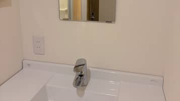 Designer toiletries, hair dryer, towels, shampoo