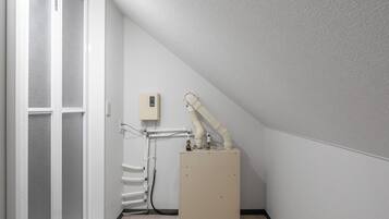 Combined shower/tub, free toiletries, hair dryer, slippers