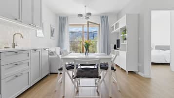 Classic Apartment, Courtyard View | Living area | 40-inch TV with satellite channels, Netflix, streaming services