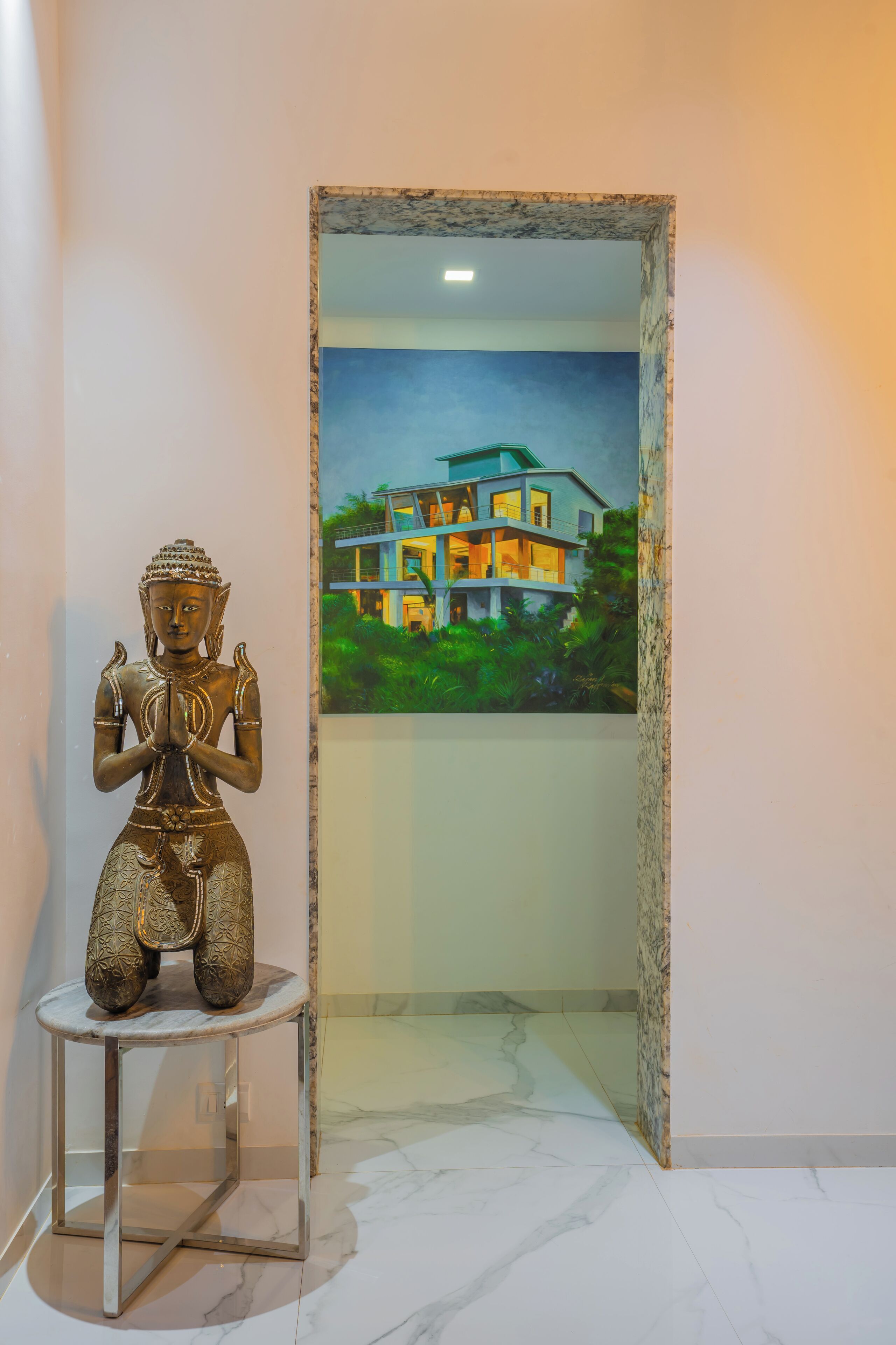 A statue on a pedestal in a hallway with a painting of a house in the background.