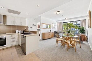 Fridge, microwave, oven, stovetop - Coastal Escape Steps to Beach Full Resort Living (Burleigh Heads)