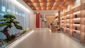 A modern interior with a wooden ceiling, a reception desk, and shelves with decorative items. - She County Liuyue Qingshe Guesthouse  (Huangshan)