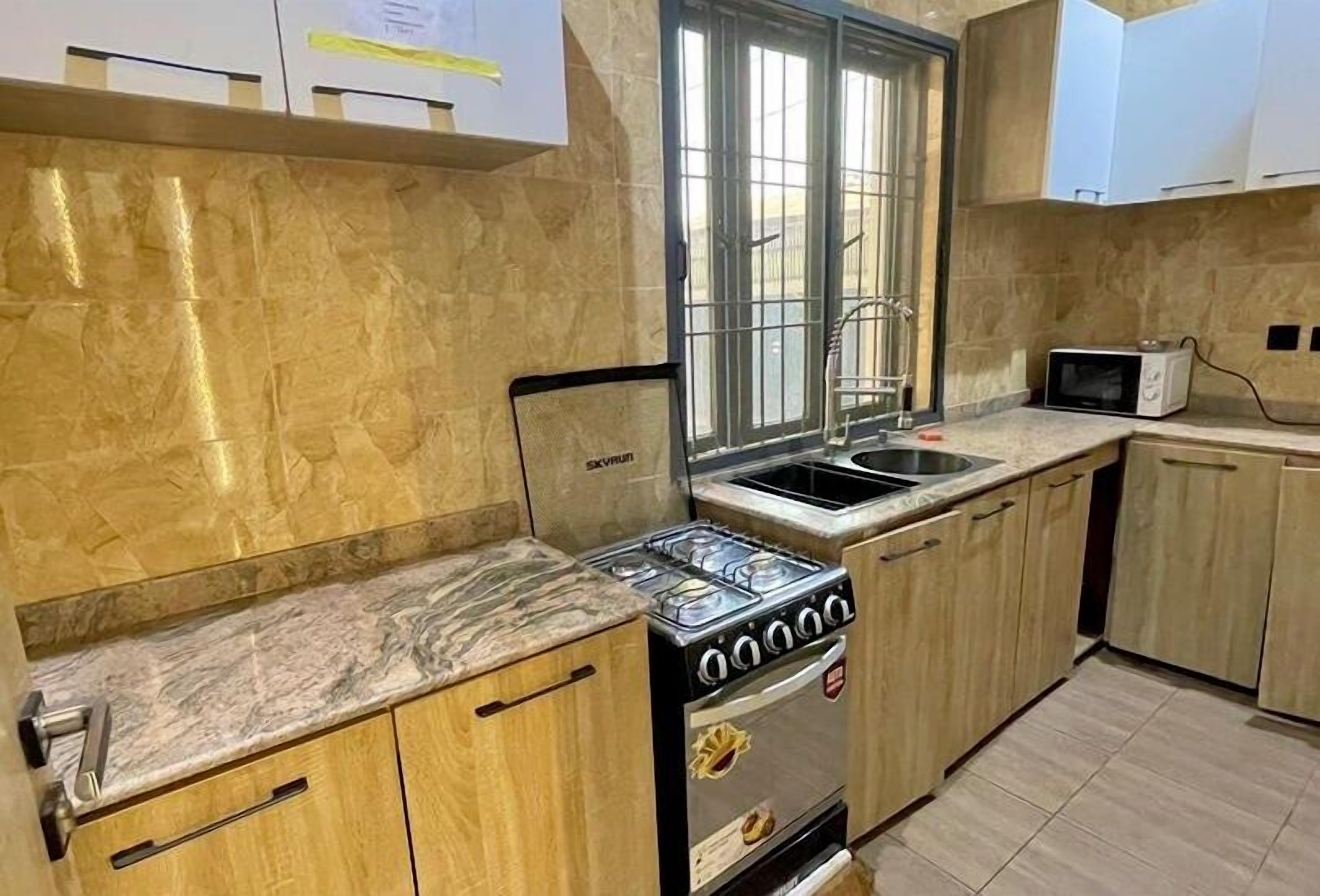 Economy Apartment, Balcony, City View | Private kitchen | Fridge, microwave, oven, stovetop