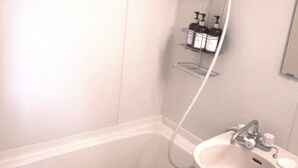 A bathroom with a bathtub, a sink, and a shower. - XeroB HOUSE FLOLIA203 (Osaka, Naniwa Ward, Nanbanaka)