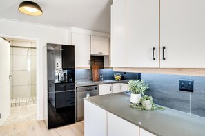 Fridge, microwave, oven, stovetop - Green Point Modern 2bed Apartment Azura Atlantic (Cape Town)