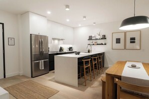 Fridge, microwave, oven, stovetop - Elevated 2-Bed, 2-Bath Condo with Curated, Editorial-Inspired Interior by Revelstoke Mountain Resort (Revelstoke)