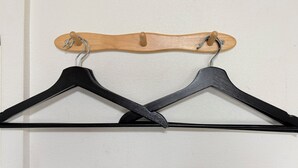 Two black hangers and one wooden hanger on a wall. - XeroB HOUSE FLOLIA601 (osaka naniwa ward nanbanaka)