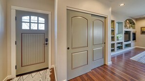 A hallway with a double door, a small window, and a fireplace with shelves. - Spacious 2BDRM, 2BA on the quiet edge of downtown Salida, Mountain Views, 2 blocks to shops (Salida)