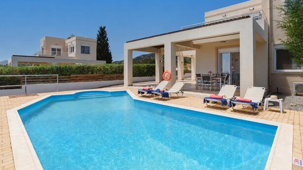 A swimming pool with lounge chairs and a covered seating area. - Villa Nicole Gennadi (2W76+JJ South Rhodes, Greece)