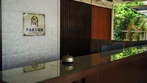 A reception area with a sign reading "PAKUAN RESIDENCE". - Pakuan Residence Hotel (Bogor)