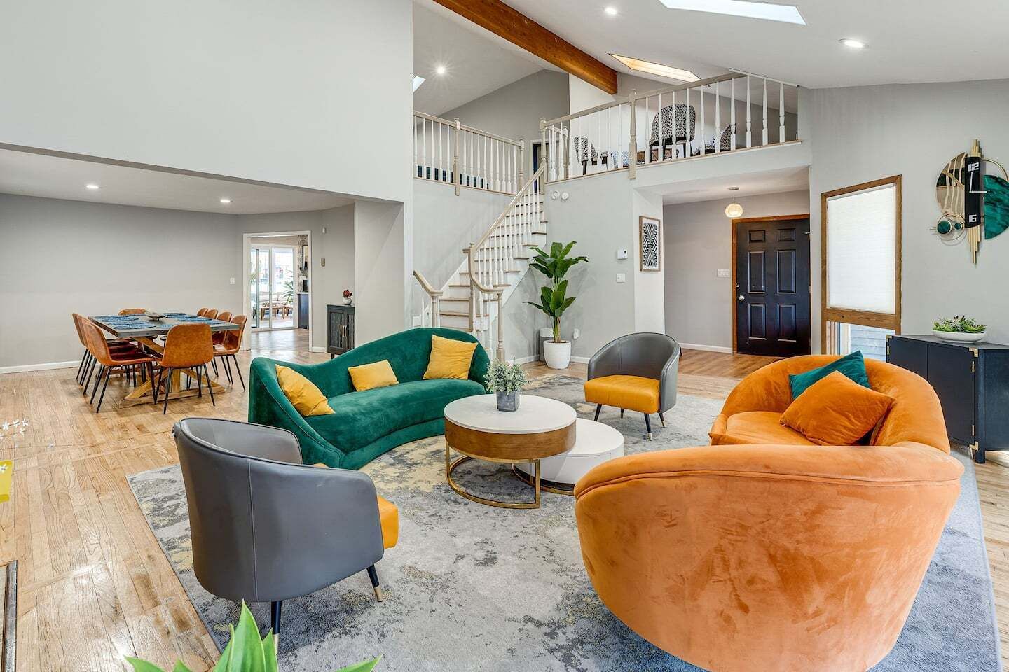 Gather your loved ones in this vibrant living space, perfect for lively conversations or simply unwinding in stylish comfort.