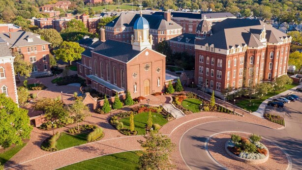 A large, historic building with a prominent dome and multiple towers, surrounded by well-maintained gardens and a roundabout. - Steps from University of Dayton + Restaurant&Pool (dayton)