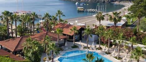 Seasonal outdoor pool, pool umbrellas, pool loungers