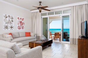 Living area - Top Floor, Oceanfront 1-bedroom suite w/balcony and the best view of Grace Bay (Grace Bay)
