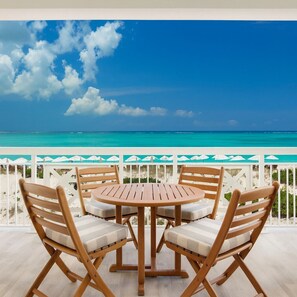 Outdoor dining - Top Floor, Oceanfront 1-bedroom suite w/balcony and the best view of Grace Bay (Grace Bay)