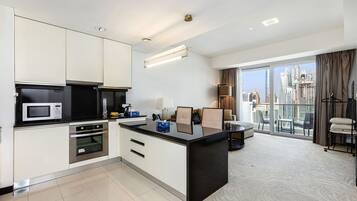 Premium Apartment, 1 Bedroom, Balcony, Canal View | Private kitchen | Espresso maker, electric kettle, toaster, cleaning supplies