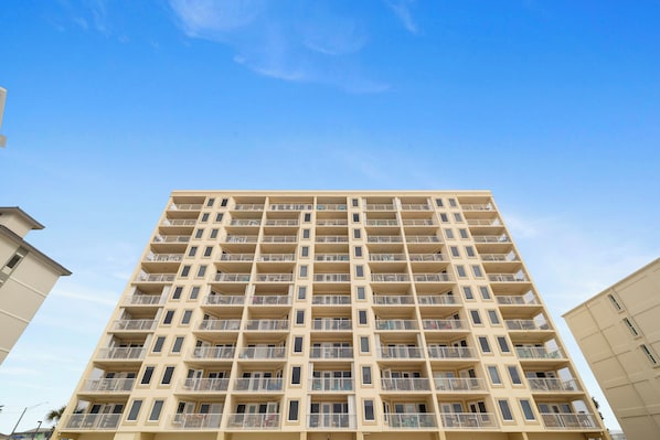 A high-rise building with multiple balconies and a uniform facade. - Boardwalk 886 by Liquid Life (Gulf Shores)