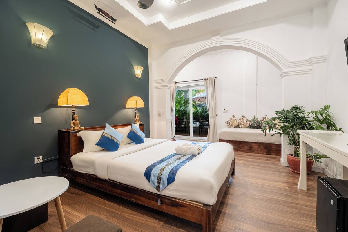 Deluxe Double Room, 1 Bedroom, Poolside | Minibar, in-room safe, desk, laptop workspace