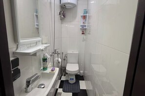 Shower, towels, soap, toilet paper