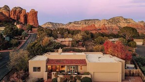 A modern two-story house with a garage, surrounded by a landscaped garden and a mountain backdrop. - A Sedona Scenic Escape w/ Private Wellness Center (Sedona)