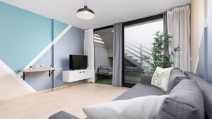 Ein modernes Wohnzimmer mit einem grauen Sofa, einem Flachbildfernseher, einem kleinen Tisch mit Dekoration und einer Treppe, die zu einer oberen Etage führt.