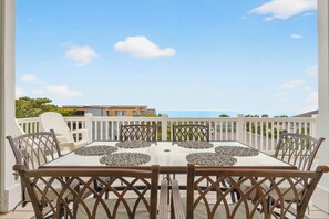 Outdoor dining - Spacious 6BR Retreat | Steps to Beach Access, Elevator, Resort Pool Access (Ocean Isle Beach)