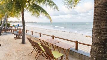 On the beach, sun loungers, beach umbrellas