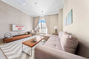 TV - Free housekeeping visits during your stay - StayShort - 2BR in Dubai Marina that Sleeps 6 with Water Views! (Dubai Marina)