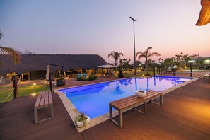 Outdoor pool, open 8:00 AM to 7:00 PM, pool umbrellas, pool loungers