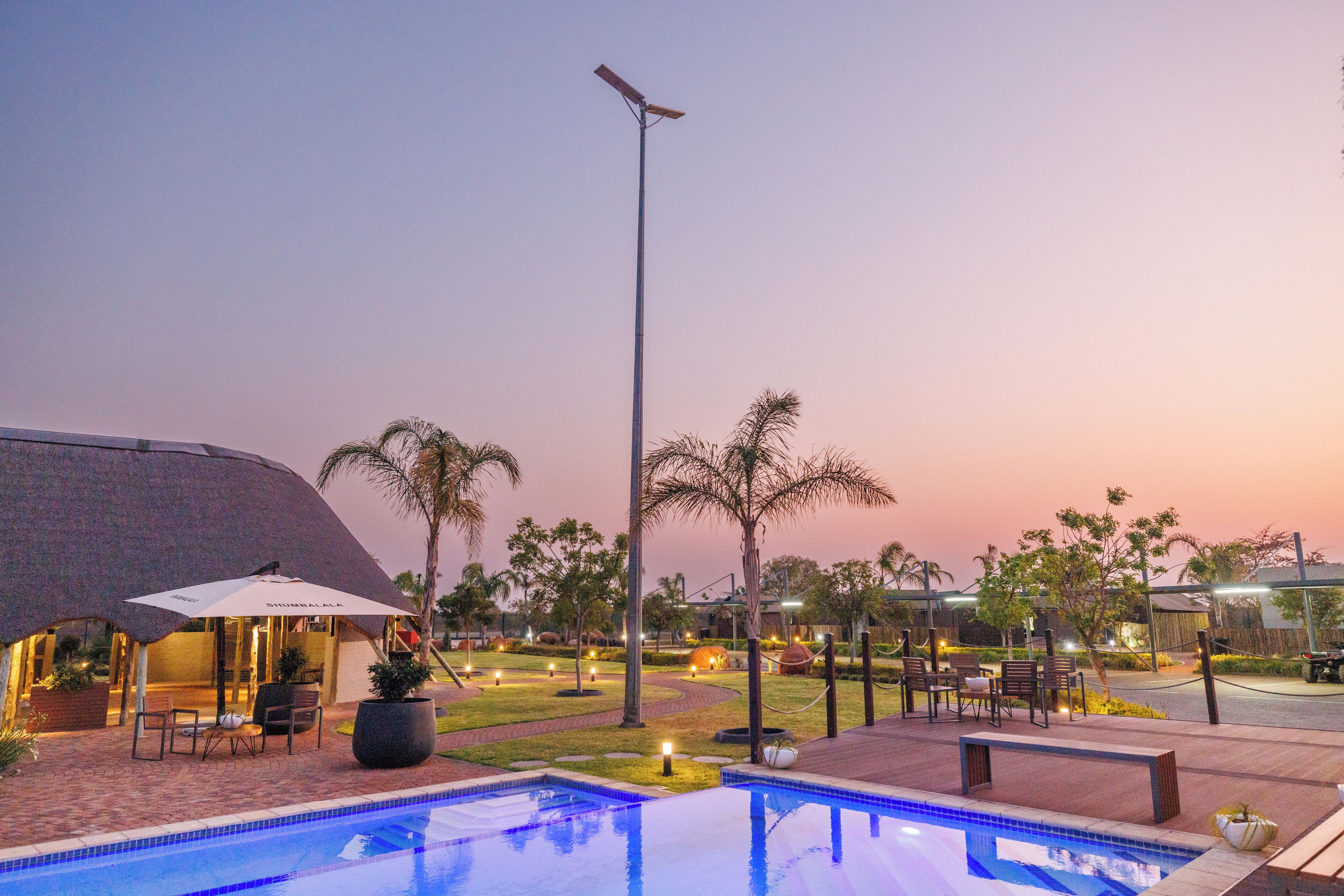 Outdoor pool, open 8:00 AM to 7:00 PM, pool umbrellas, pool loungers